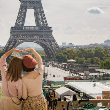 photo-of-two-women-posing-in-front-of-eiffel-tower-paris-597049