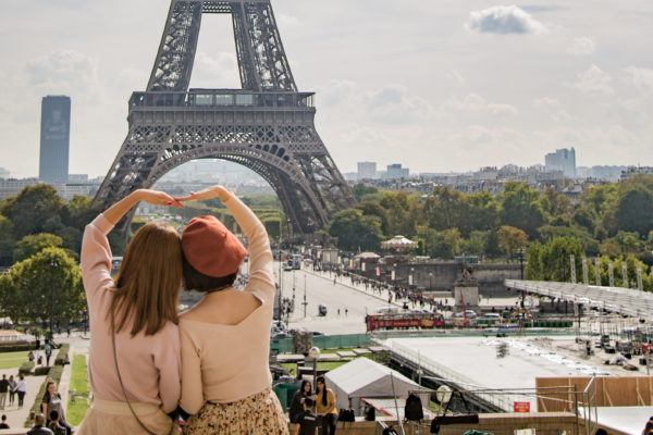 photo-of-two-women-posing-in-front-of-eiffel-tower-paris-597049